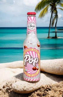 Bottle of POP Coconut dream on a beach with palm trees and ocean in the background